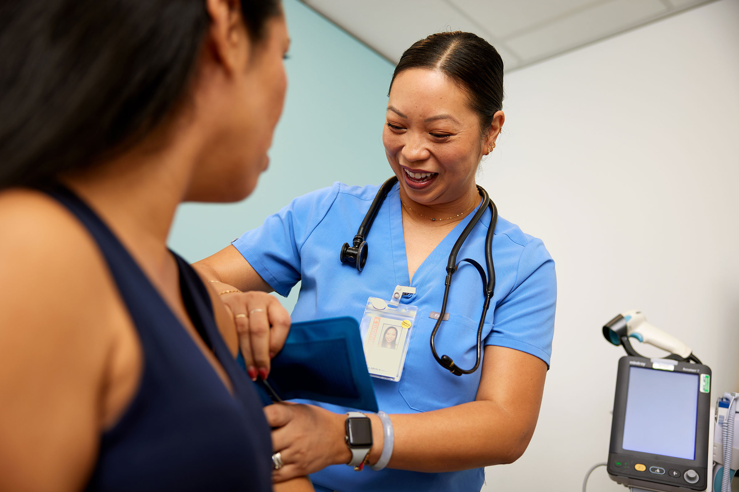 Nurse checking patient's blood pressure during a maternity appointment Nurse checking patient's blood pressure during a maternity appointment
