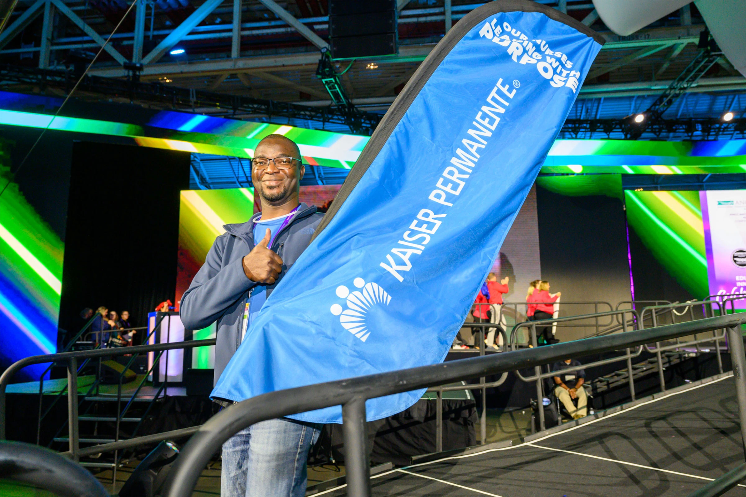 Nurse holding KP flag
